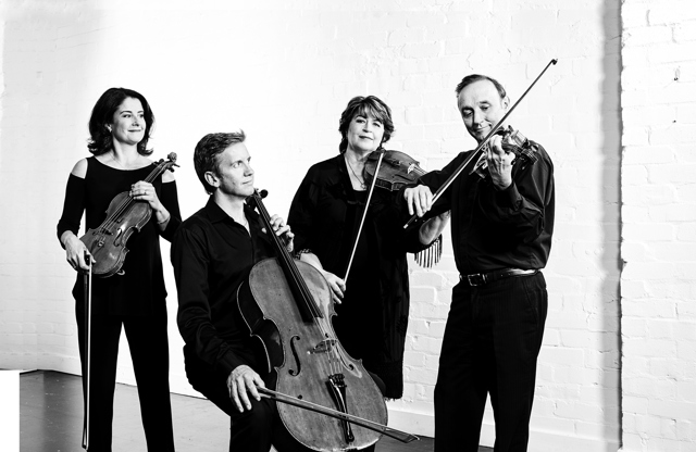 Goldner String Quartet playing instruments